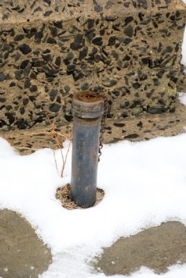 Unusual Pipes with Threaded Caps on Either Side of Monument image. Click for full size.
