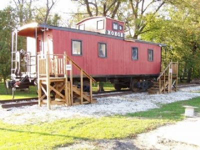 Monon Caboose in the park (site of Monon Station). image, Touch for more information
