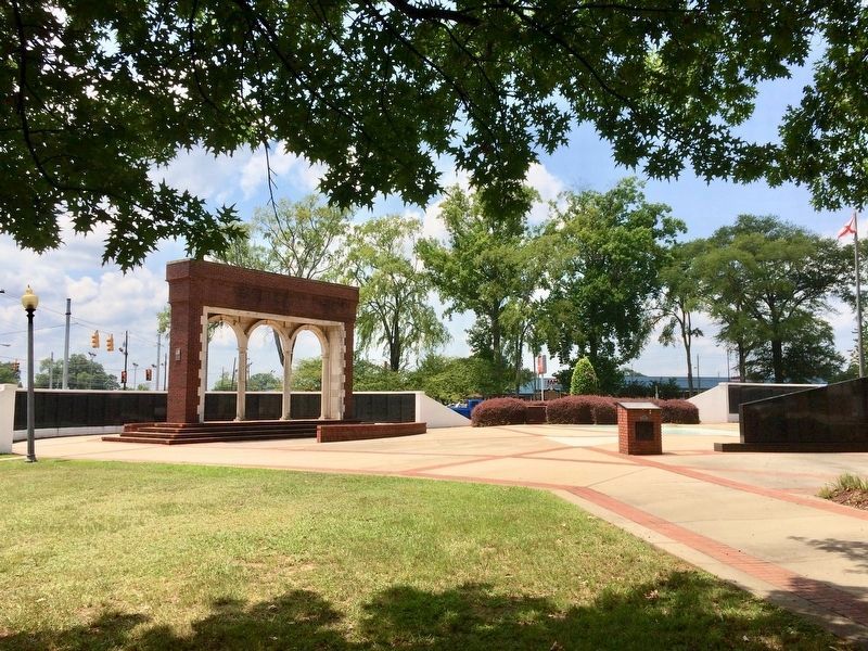 View of marker in far background of memorial park. image. Click for full size.